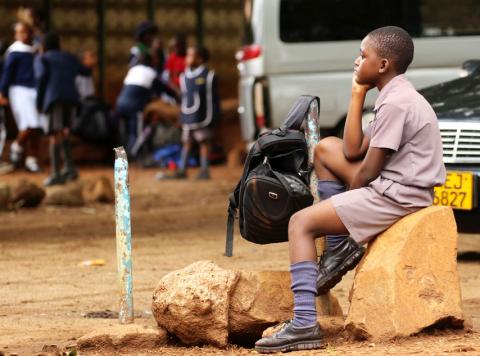 A Zimbabwean schoolchild awaits transport from school during a teachers' strike in Harare, Zimbabwe, February 8, 2019. REUTERS/Philimon Bulawayo