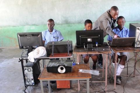 Pupils use solar-powered computers at Gomba High School in Gutu, Zimbabwe. PHOTO BY REUTERS/Jonathan Njerere