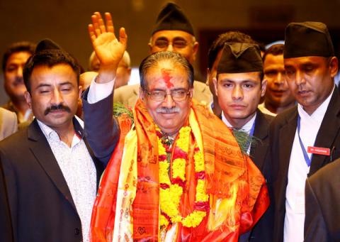 Nepal's newly elected Prime Minister Pushpa Kamal Dahal, also known as Prachanda, waves towards the media after he was elected Nepal's 24th prime minister in 26 years, in Kathmandu, Nepal, August 3, 2016. PHOTO BY REUTERS/Navesh Chitrakar