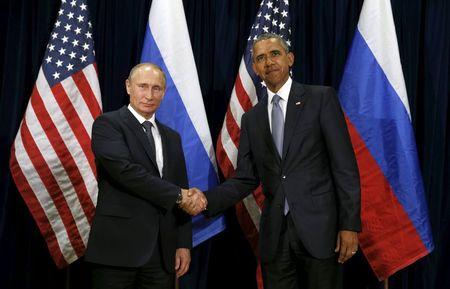 U.S. President Barack Obama shakes hands with Russian President Vladimir Putin during their meeting at the United Nations General Assembly in New York, September 28, 2015. PHOTO BY REUTERS/Kevin Lamarque