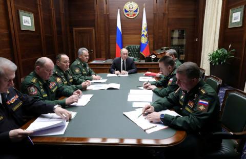 Russia's President Vladimir Putin (C) meets with the commanders of Russian military districts and the Northern Fleet as part of a session of the Defence Ministry Board in Moscow, Russia, December 18, 2018. PHOTO BY REUTERS/Sputnik/Mikhail Klimentyev/Kremlin