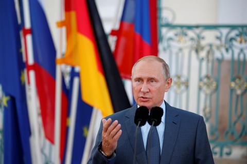 Russian President Vladimir Putin speaks next to German Chancellor Angela Merkel (not pictured) at the guest house Meseberg Palace in Gransee, Germany, August 18, 2018. PHOTO BY REUTERS/Axel Schmidt
