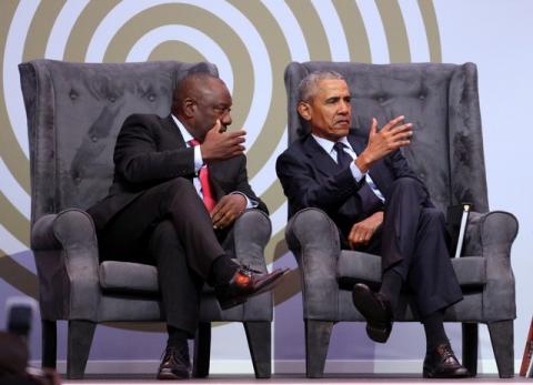 South African President Cyril Ramaphosa talks to former U.S. President Barack Obama at the 16th Nelson Mandela annual lecture, marking the centenary of the anti-apartheid leader's birth, in Johannesburg, South Africa, July 17, 2018. PHOTO BY REUTERS/Siphiwe Sibeko