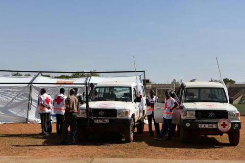 Red Cross members stand at the municipal stadium where an emergency medical post was established, after a coordinated assault on the army headquarters and French embassy in the capital Ougadougou, Burkina Faso, March 2, 2018. PHOTO BY REUTERS/Anne Mimault