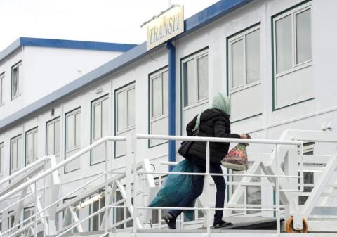 A refugee arrives at the Dutch-owned houseboat 'Transit' in the harbour of Hamburg, February 26, 2015. PHOTO BY REUTERS/Fabian Bimmer