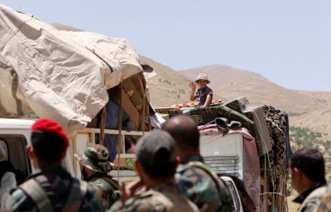 A Syrian refugee boy who left Lebanon gestures as he arrives in Qalamoun, Syria, June 28, 2018. PHOTO BY REUTERS/Omar Sanadiki
