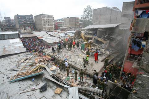 A general view shows rescue workers searching for residents feared trapped in the rubble of a six-storey building that collapsed after days of heavy rain, in Nairobi, Kenya, April 30, 2016. PHOTO BY REUTERS/Gregory Olando
