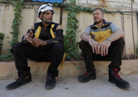 Syrian rescue worker Samir Salim sits next to his colleague Ahmed Rashid during an interview with Reuters in Azaz, Syria, July 8, 2018. PHOTO BY REUTERS/Khalil Ashawi