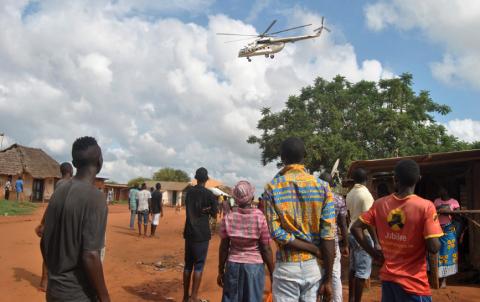 Residents look at a police helicopter patrolling near the closed house, where Italian volunteer for the Italian charity Africa Milele lived before she was seized, in Chakama trading centre of Magarini, Kilifi County, Kenya, November 21, 2018. PHOTO BY REUTERS/Stringer