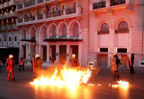 Greek riot police officers dodge petrol bomb thrown by protesters during minor clashes following a protest outside parliament in central Athens where lawmakers were discussing controversial tax and pension reforms, May 8, 2016. PHOTO BY REUTERS/Alkis Konstantinidis