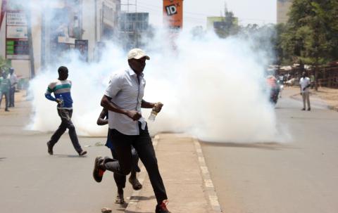 Riot police fire teargas canisters to disperse supporters of Kenyan opposition leader Raila Odinga of the National Super Alliance (NASA) coalition protesting against the treason charges on lawyer Miguna Miguna in the streets of Kisumu, Kenya, February 6, 2018. PHOTO BY REUTERS/James Keyi