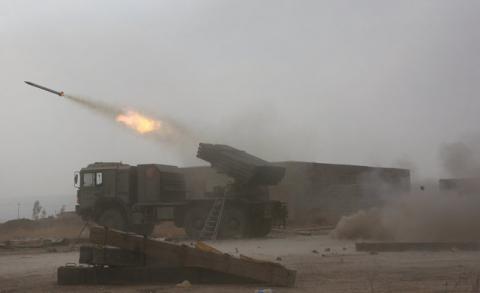 Popular Mobilization Forces (PMF) fire towards Islamic State militants during a battle on the outskirts of Al-Ba'aj, west of Mosul, Iraq, May 26, 2017. PHOTO BY REUTERS/Stringer