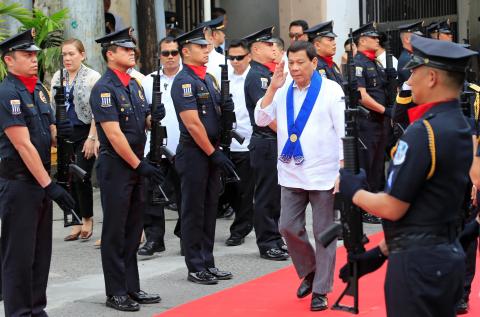 President Rodrigo Duterte salutes while passing members of custom police, during the 116th Bureau of Customs founding anniversary in Metro Manila, Philippines, February 6, 2018. PHOTO BY REUTERS/Romeo Ranoco