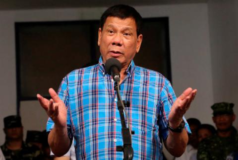 Philippine President Rodrigo Duterte gestures during a briefing with the military after his visit at Camp General Basilio Navarro in Zamboanga City, Philippines, November 25, 2016. PHOTO BY REUTERS/Malacanang Photo