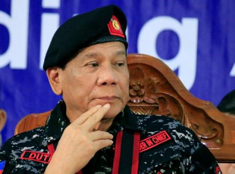 Philippine President Rodrigo Duterte, wearing a military uniform, gestures as he attends the 67th founding anniversary of the First Scout Ranger regiment in San Miguel town, Bulacan province, north of Manila, Philippines, November 24, 2017. PHOTO BY REUTERS/Romeo Ranoco