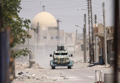 A military vehicle of SDF in west of Raqqa province, Syria, June 18, 2017. PHOTO BY REUTERS/Rodi Said