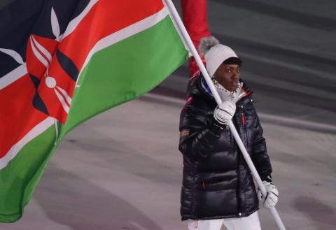 Sabrina Simander of Kenya carries the national flag, February 9, 2018. PHOTO BY REUTERS/Carlos Barria