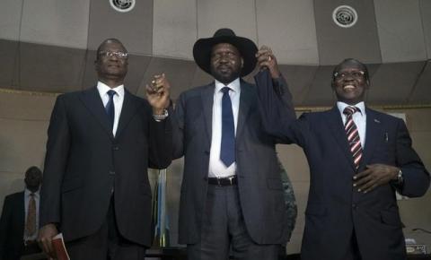 South Sudan's President Salva Kiir (C) holds hands with First Vice President Taban Deng Gai (L) and Second Vice President James Wani Igga (R) inside the Presidential Palace in the capital of Juba, South Sudan, July 26, 2016. PHOTO BY REUTERS/Adriane Ohanesian