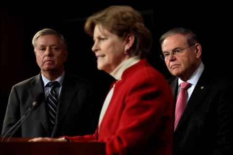 Senators Lindsey Graham (R-SC) (L) and Bob Menendez (D-NJ) listen to Senator Jeanne Shaheen (D-NH) speak during a news conference on the death of Saudi dissident Jamal Khashoggi and the humanitarian crisis in Yemen, on Capitol Hill in Washington, U.S., December 12, 2018. PHOTO BY REUTERS/Yuri Gripas