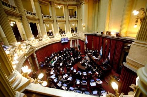 Senators debate the approval of a settlement with creditors over the country's defaulted debt at the Senate in Buenos Aires, Argentina, March 30, 2016. PHOTO BY REUTERS/Marcos Brindicci