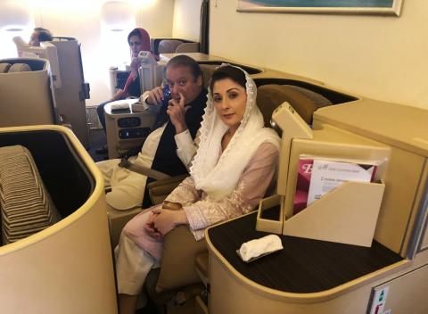 Ousted Pakistani Prime Minister Nawaz Sharif and his daughter Maryam sit on a Lahore-bound flight due for departure, at Abu Dhabi International Airport, UAE, July 13, 2018. PHOTO BY REUTERS/Drazen Jorgic