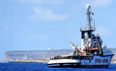 Spanish migrant rescue ship Open Arms is seen in front of the "Door to Europe" monument, close to the Italian shore in Lampedusa, Italy, August 16, 2019. PHOTO BY REUTERS/Guglielmo Mangiapane