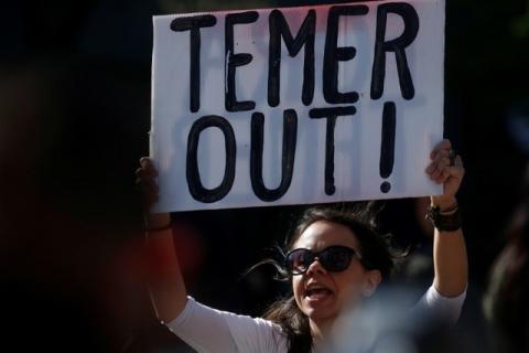 A woman demonstrates against Brazil's president Michel Temer during a protest in Union Square in the Manhattan borough of New York City, New York, U.S., May 21, 2017. PHOTO BY REUTERS/Carlo Allegri