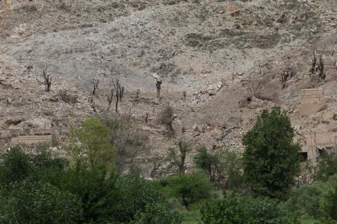 Burn trees are seen the site of a MOAB, or ''mother of all bombs'', which struck the Achin district of the eastern province of Nangarhar, Afghanistan, April 23, 2017. PHOTO BY REUTERS/Parwiz