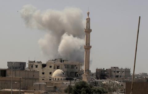 Smoke rises after an air strike during fighting between members of the Syrian Democratic Forces and Islamic State militants in Raqqa, Syria, August 20, 2017. PHOTO BY REUTERS/Zohra Bensemra