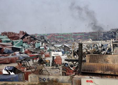 Smoke is seen near the site of last week's explosions at Binhai new district in Tianjin, China, August 17, 2015. PHOTO BY REUTERS/Kim Kyung-Hoon