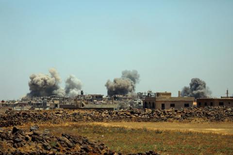 Smoke rises from al-Harak town, as seen from Deraa countryside, Syria, June 25, 2018. PHOTO BY REUTERS/Alaa al-Faqir