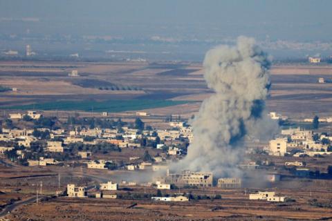 Smoke following an explosion in Syria is seen from the Israeli-occupied Golan Heights near the Israeli Syrian border, July 16, 2018. PHOTO BY REUTERS/Ronen Zvulun