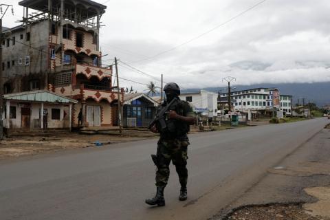 A Cameroonian elite Rapid Intervention Battalion (BIR) member walks along an empty street while patroling in the city of Buea in the anglophone southwest region, Cameroon, October 4, 2018. PHOTO BY REUTERS/Zohra Bensemra