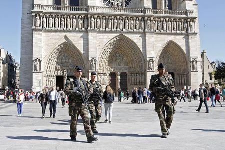 French soldiers patrol outside the Notre Dame Cathedral as part of the "Vigipirate" security plan in Paris, April 22, 2015. PHOTO BY REUTERS/Charles Platiau