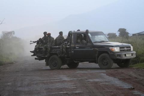 Soldiers from the Democratic Republic of Congo (DRC) arrive on an open military truck near the town of Kibumba at its border with Rwanda after fighting broke out in the Eastern Congo town, June 11, 2014. PHOTO BY REUTERS/Kenny Katombe