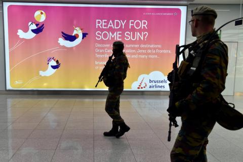 Soldiers walk in the departure hall after a ceremony at Brussels Airport as it reopens 40 days after deadly attacks in Zaventem, Belgium, May 1, 2016. PHOTO BY REUTERS/Eric Vidal