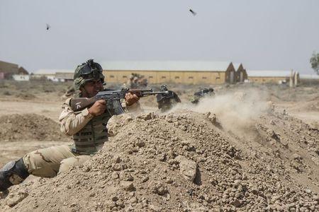 Iraqi soldiers train with members of the U.S. Army 3rd Brigade Combat Team, 82nd Airborne Division, at Camp Taji, Iraq, in this U.S. Army photo released, June 2, 2015. PHOTO BY REUTERS/U.S. Army