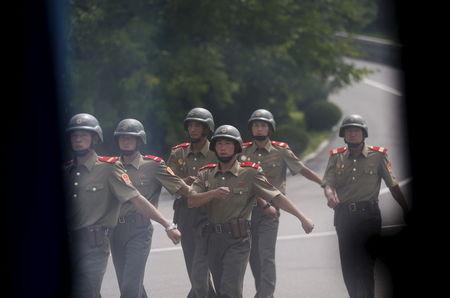 North Korean soldiers patrol at the truce village of Panmunjom in the demilitarised zone (DMZ) separating the two Koreas, South Korea, August 11, 2015. PHOTO BY REUTERS/Kim Hong-Ji