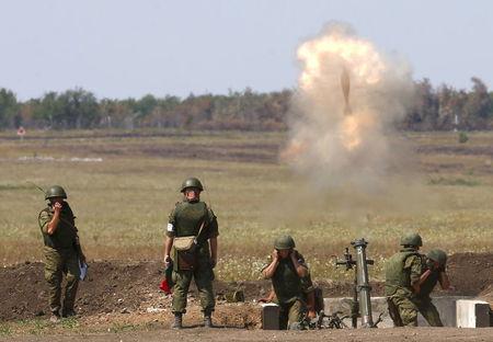 Russian navy servicemen leave an armoured personnel carrier (APC) as they take part in the Caspian Derby-2015 international naval contest during the International Army Games-2015 in the Dagestan's port city of Kaspiysk, Russia, August 5, 2015. REUTERS/Sergei Karpukhin