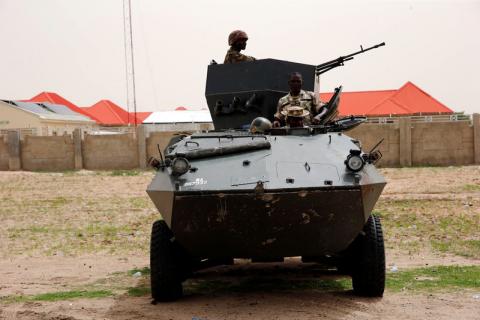 Soldiers stand guard on a armoured tank outside an internal displaced persons (IDP) camp during the official flag-off of food and relief materials distribution for the internal displaced persons in Nigerian city of Maiduguri, June 8, 2017. PHOTO BY REUTERS/Akintunde Akinleye