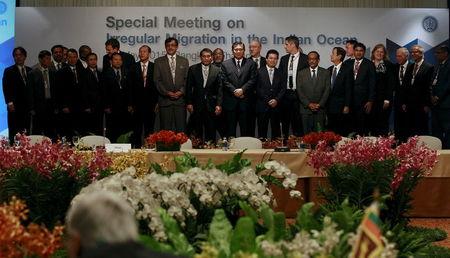 Thailand's Deputy Prime Minister and Foreign Minister General Tanasak Patimapragorn (C) poses with delegates during an opening ceremony of the Special Meeting on Irregular Migration in the Indian Ocean at a hotel in Bangkok, Thailand, May 29, 2015. PHOTO BY REUTERS/Chaiwat Subprasom