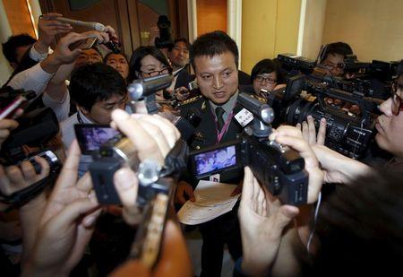 Spokesman for China's Ministry of Defence Yang Yujun speaks to reporters after a bilateral meeting with Japan ahead of the International Institute for Strategic Studies' (IISS) Shangri-La Dialogue in Singapore, May 29, 2015. PHOTO BY REUTERS/Edgar Su