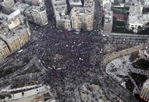 An aerial view made from an Egyptian army helicopter shows a general view of supporters of Egypt's army and police gathering at Tahrir Square in Cairo, on the third anniversary of Egypt's uprising, January 25, 2014 file photo