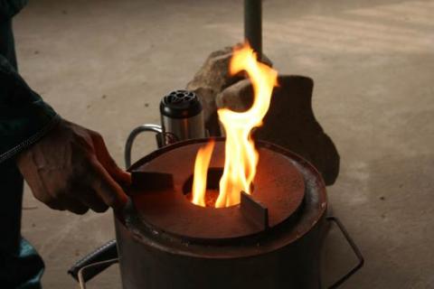 A new efficient stove that burns rice husks with the aid of a solar-powered blower. PHOTO BY REUTERS/Busani Bafana