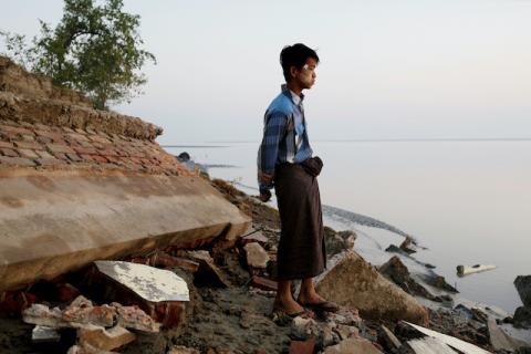 A student stands near the rubble of a school after it collapsed into the water in Ta Dar U village, Bago, Myanmar, February 6, 2020. PHOTO BY REUTERS/Ann Wang