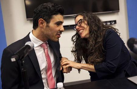 Gay Syrian refugee Subhi Nahas (L) confers with Jessica Stern, Executive Director of the International Gay & Lesbian Human Rights Commission (R) looks on, at a news conference at the United Nations headquarters in New York, August 24, 2015. PHOTO BY REUTERS/Mike Segar
