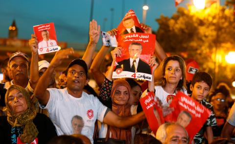 Supporters of detained Tunisian media mogul and presidential candidate Nabil Karoui carry his pictures during an election campaign rally in Tunis, Tunisia, on September 13, 2019. PHOTO BY REUTERS/Zoubeir Souissi