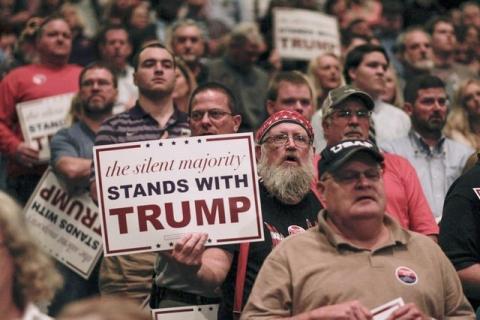 People listen as Republican U.S. presidential candidate Donald Trump addresses a campaign rally in Macon, Georgia, November 30, 2015. PHOTO BY REUTERS/Christopher Aluka Berry