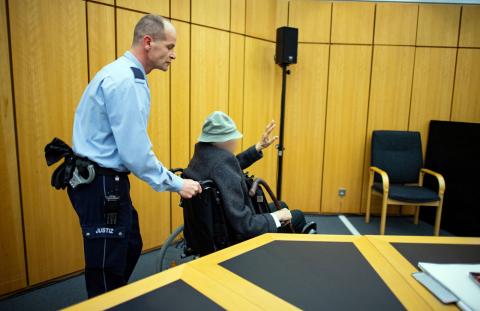 A 94-year-old wheelchair-bound man appeared in court in Muenster, Germany, November 6, 2018, accused of helping to murder hundreds of people at a Nazi concentration camp during World War Two, in what is likely to be one of the last such trials. PHOTO BY REUTERS/Guido Kirchner