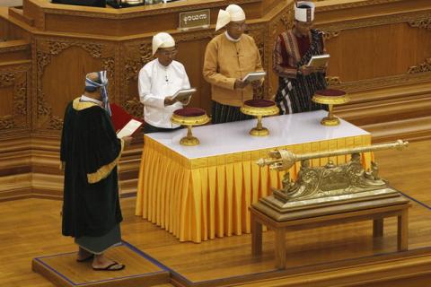 Myanmar's new president Htin Kyaw (C), first Vice President Myint Swe (L) and second Vice President Henry Van Thio attend their swearing-in at union parliament in Naypyidaw, March 30, 2016. PHOTO BY REUTERS/Soe Zeya Tun